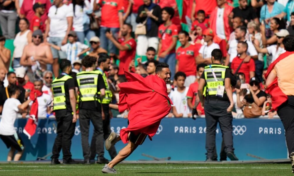 Olympic soccer gets off to violent and chaotic start as Morocco fans rush the field vs Argentina