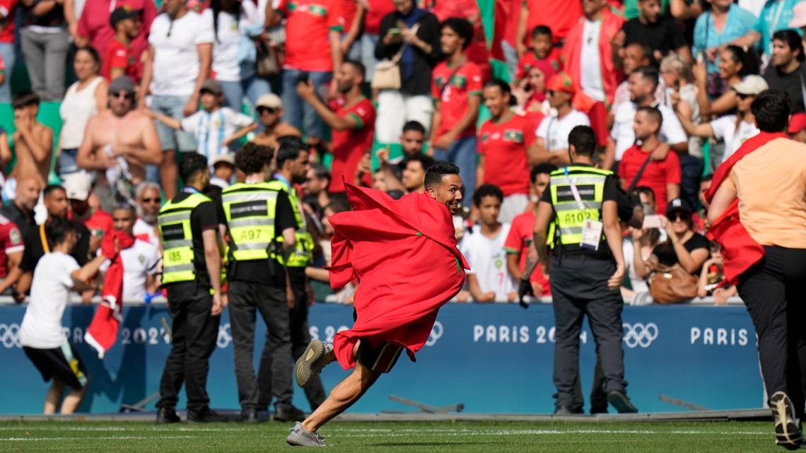 Olympic soccer gets off to violent and chaotic start as Morocco fans rush the field vs Argentina