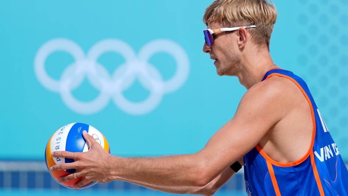 Dutch beach volleyball player who was convicted of rape is booed before losing first Olympic match