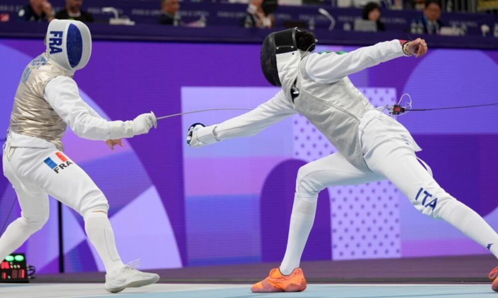 Why are fencers attached to a cable?