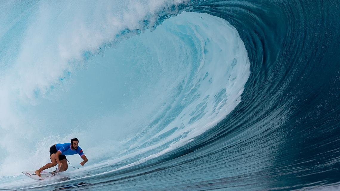 Waterproof gear and jet skis: How photographers are capturing incredible surfing shots at the Olympics