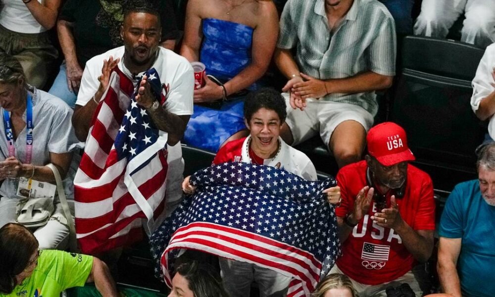 Simone Biles' husband, Jonathan Owens, cheers in the stands as she tries for gold in Paris