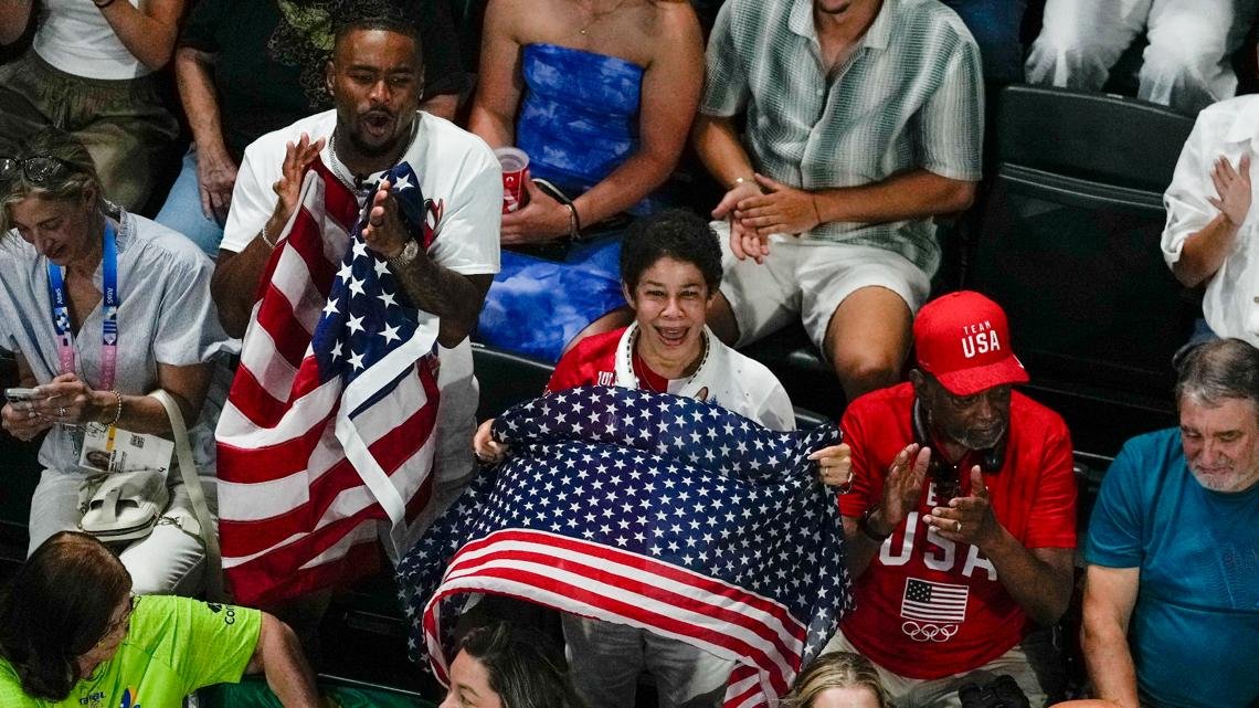 Simone Biles' husband, Jonathan Owens, cheers in the stands as she tries for gold in Paris