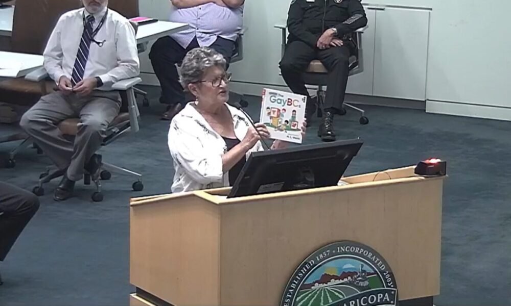 A screenshot of Glennwilde resident Christine Belanger as she holds a copy of M.L. Webb's "The GayBCs" during a city council meeting on July 16, 2024. [City of Maricopa]