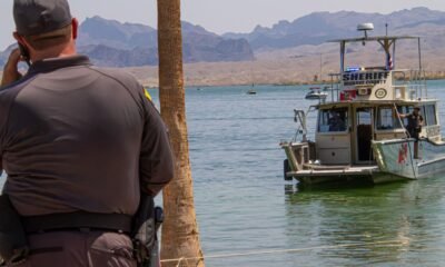 Sheriffs deputies extract barrel from lake