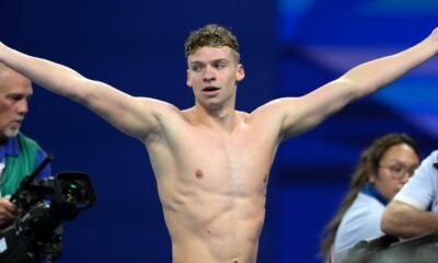 Léon Marchand captures 4th Olympic swimming gold, setting off a party across Paris