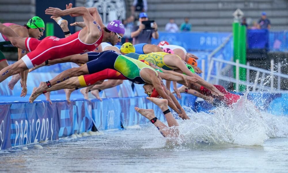 Olympic triathletes plunge into Seine River for mixed relay amid concerns with water quality