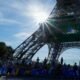 Police arrest a man climbing the Eiffel Tower, prompting an evacuation hours before closing ceremony