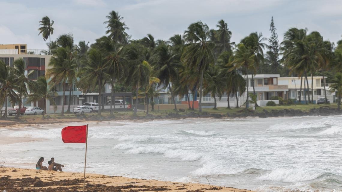 Ernesto has intensified into a hurricane and is on a path toward Bermuda, forecasters say