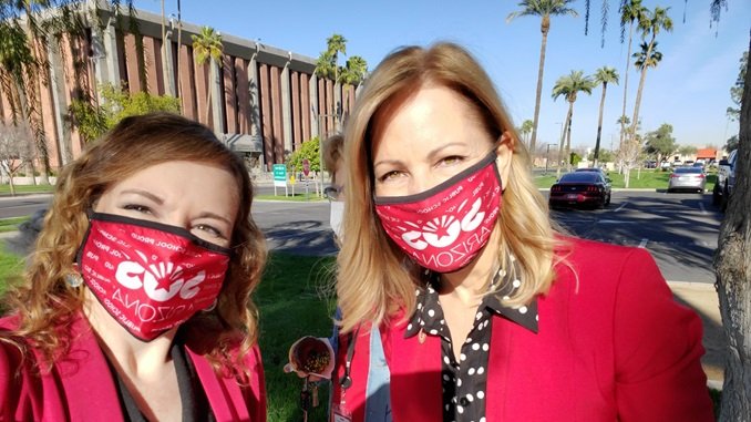 Kelli Butler with another woman wearing masks