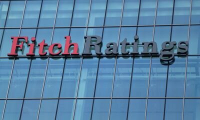 A sign for Fitch Ratings sits on the side of a building in 2012. [Gideon Benari/Flickr]