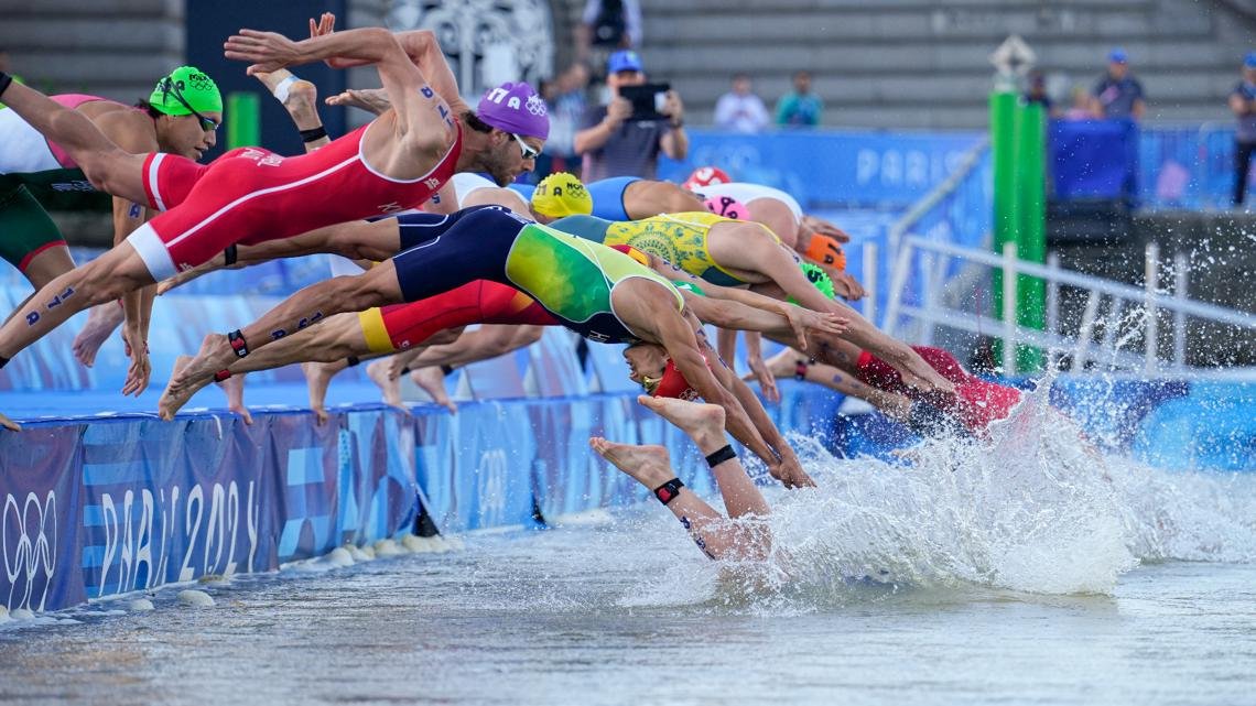 Despite water quality concerns, Olympic triathlon gets underway with mixed relay in Seine