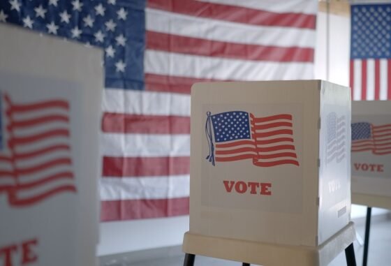 voting booths with American flag