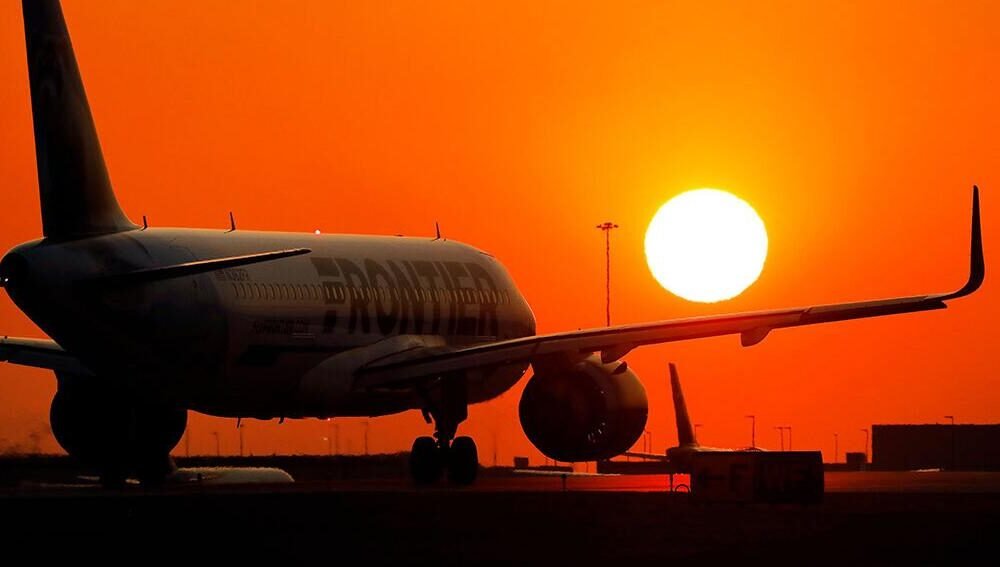 Authorities are investigating after a Frontier Airlines plane lands with fire in one engine