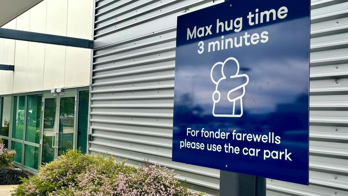 A New Zealand airport wants you to hug goodbye faster