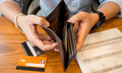 empty wallet with credit cards on table