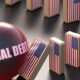 national debt ball knocks over American flag dominoes