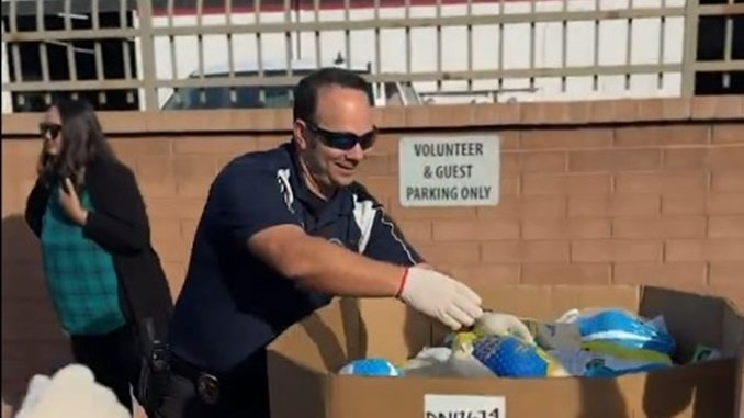 police officer distributing turkey