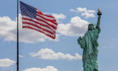 American flag and the Statue of Liberty