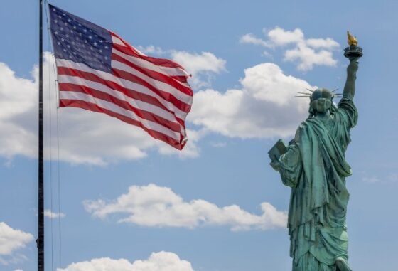 American flag and the Statue of Liberty