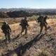 As Trump touts plans for immigrant roundup, militias are standing back, but standing by