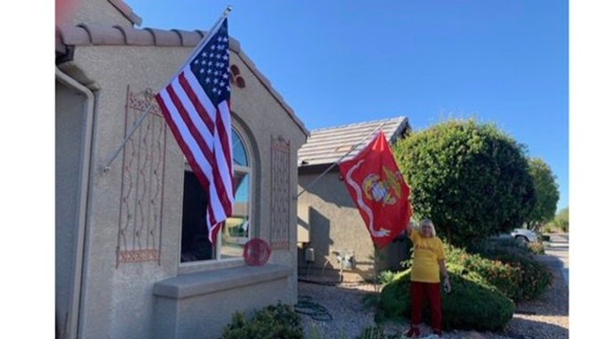 American and Marine flags on home