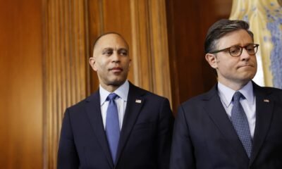 U.S. House Minority Leader Hakeem Jeffries, D-N.Y., left, and U.S. Speaker of the House Mike Johnson, R-La.,  look on during a menorah lighting ceremony during a Hanukkah reception at the U.S. Capitol Building on Dec. 17, 2024, in Washington, D.C. (Photo by Anna Moneymaker/Getty Images)