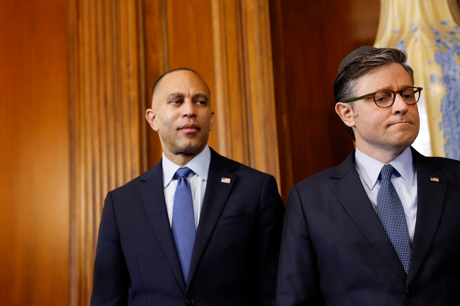 U.S. House Minority Leader Hakeem Jeffries, D-N.Y., left, and U.S. Speaker of the House Mike Johnson, R-La.,  look on during a menorah lighting ceremony during a Hanukkah reception at the U.S. Capitol Building on Dec. 17, 2024, in Washington, D.C. (Photo by Anna Moneymaker/Getty Images)