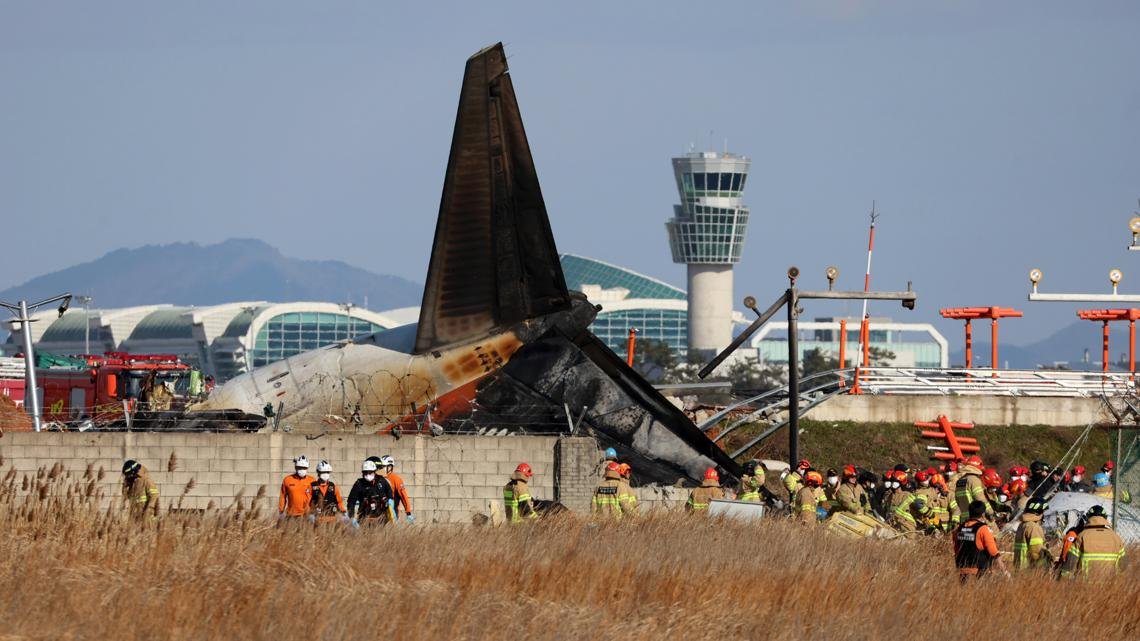 US and Boeing investigators examine the site of a deadly South Korean plane crash