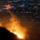 Firefighters battle to control devastating Los Angeles wildfires as ferocious winds calm somewhat