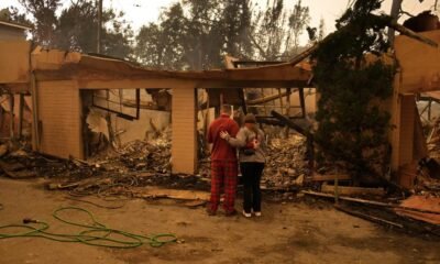 Families in shock begin to visit their charred homes in Los Angeles area