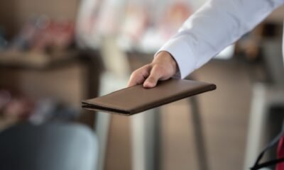 waitress holding check