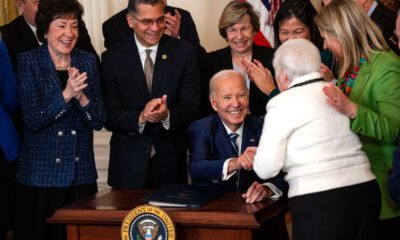 President Joe Biden gives a pen to Bette Marafino, president of the Connecticut Chapter of the Alliance for Retired Americans, after he signed the Social Security Fairness Act during an event in the East Room of the White House on Jan. 5, 2025, in Washington, D.C.  At left are Sen.  Susan Collins, R-Maine, and Health and Human Services Secretary Xavier Becerra.  The legislation will expand Social Security benefits for millions of retired Americans, including firefighters, police officers and teachers. (Photo by Kent Nishimura/Getty Images)