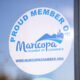 A Maricopa Chamber of Commerce sticker sits on the entrance to InMaricopa's office on Jan. 16, 2025. [Monica D. Spencer]