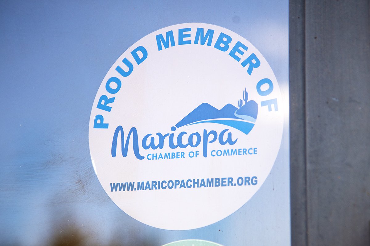 A Maricopa Chamber of Commerce sticker sits on the entrance to InMaricopa's office on Jan. 16, 2025. [Monica D. Spencer]
