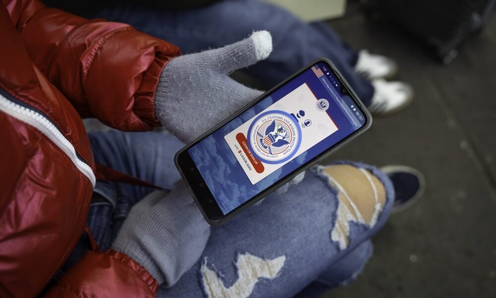 A immigrant from Venezuela tries in vain to access the CBP One app day a day after the second inauguration of President Donald Trump on Jan. 21, 2025 in Nogales, Mexico. The incoming administration shut down the app, which was created by the Biden administration to allow migrants to schedule appointments to gain entry into the United States.  (Photo by John Moore/Getty Images)