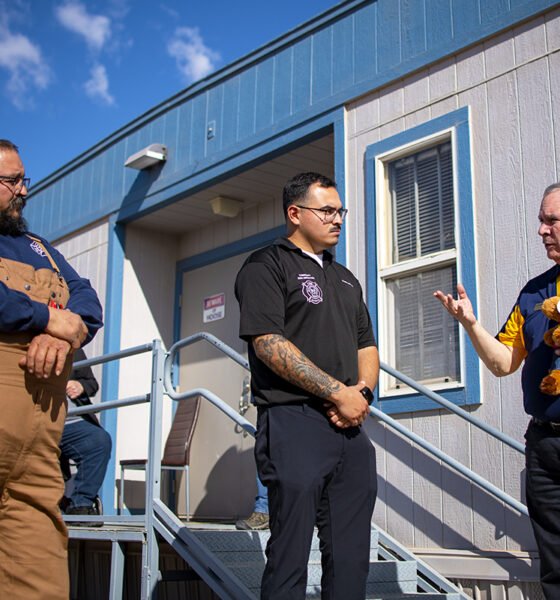 Thunderbird Fire District volunteer James Martinez and Maricopa Fire/Medical Department Community Risk Reduction Specialist Daniel Wehle listen as Moose International Board of Directors Chairman Robert Funkey talks about the Tommy Moose stuffed animal during a luncheon at the Maricopa Moose lodge on Jan. 16, 2025. [Monica D. Spencer]