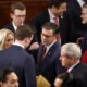 U.S. Rep. Mike Johnson, R-La., center, and Rep. Marjorie Tayler Greene, R-Ga., left, talk with fellow representatives as they arrive for the first day of the 119th Congress in the House Chamber of the U.S. Capitol Building on Jan. 3, 2025 in Washington, D.C.  (Photo by Chip Somodevilla/Getty Images)