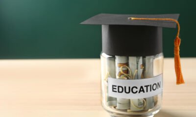 cash in jar under graduation hat