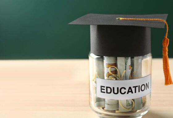 cash in jar under graduation hat