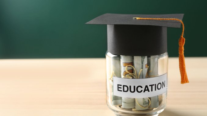 cash in jar under graduation hat