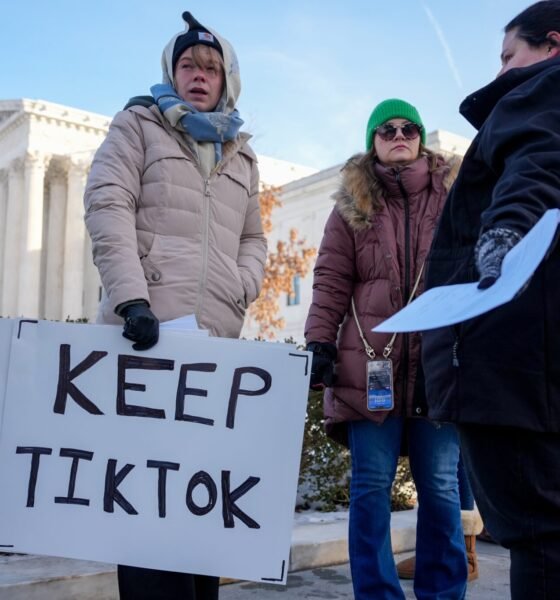 Sarah Baus of Charleston, South Carolina, left, holds a sign that reads "Keep TikTok" as she and other content creators Sallye Miley of Jackson, Mississippi, middle, and Callie Goodwin of Columbia, South Carolina, stand outside the U.S. Supreme Court Building on Jan. 10, 2025, as the court hears oral arguments on whether to overturn or delay a law that could lead to a ban of TikTok in the United States. (Photo by Andrew Harnik/Getty Images)