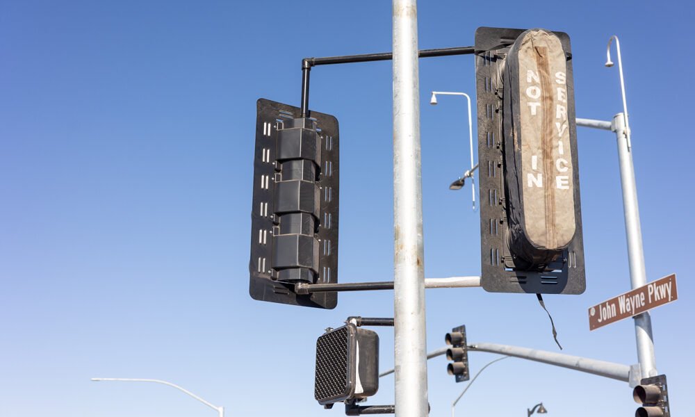 Newly installed stoplights wait to be turned on as drivers navigate the John Wayne Parkway and Smith-Enke Road intersection on Jan. 14, 2025. [Brian Petersheim Jr.]