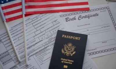 birth certificate, passports, and American flags