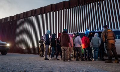 Migrants from Mexico and Guatemala are apprehended by U.S. Customs and Border Patrol officers after crossing a section of border wall into the U.S. on Jan. 4, 2025 in Ruby, Arizona. (Photo by Brandon Bell/Getty Images)