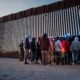 Migrants from Mexico and Guatemala are apprehended by U.S. Customs and Border Patrol officers after crossing a section of border wall into the U.S. on Jan. 4, 2025 in Ruby, Arizona. (Photo by Brandon Bell/Getty Images)