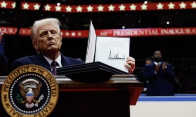 President Donald Trump holds up an executive order after signing it during an indoor inauguration parade at Capital One Arena on Jan. 20, 2025, in Washington, D.C. (Photo by Anna Moneymaker/Getty Images)