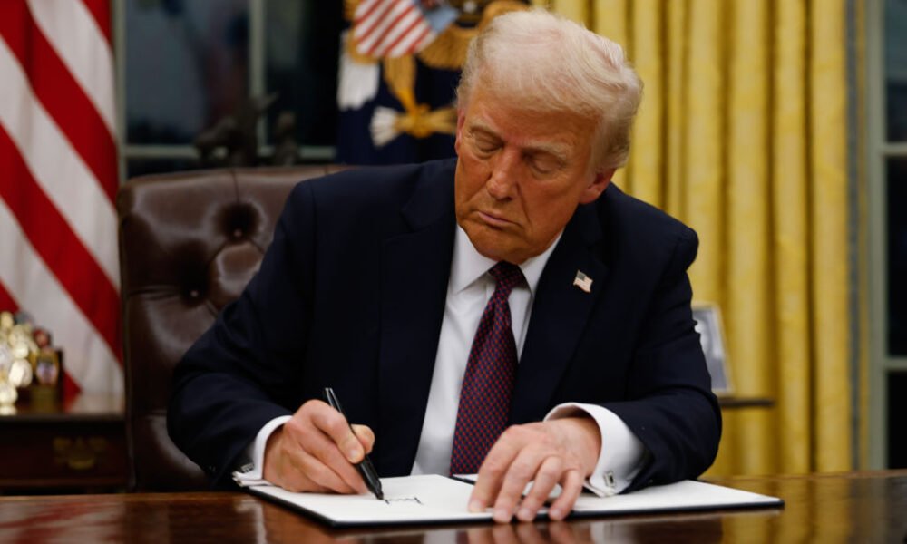 President Donald Trump signs executive orders in the Oval Office of the White House on Jan. 20, 2025, in Washington, D.C.  (Photo by Anna Moneymaker/Getty Images)