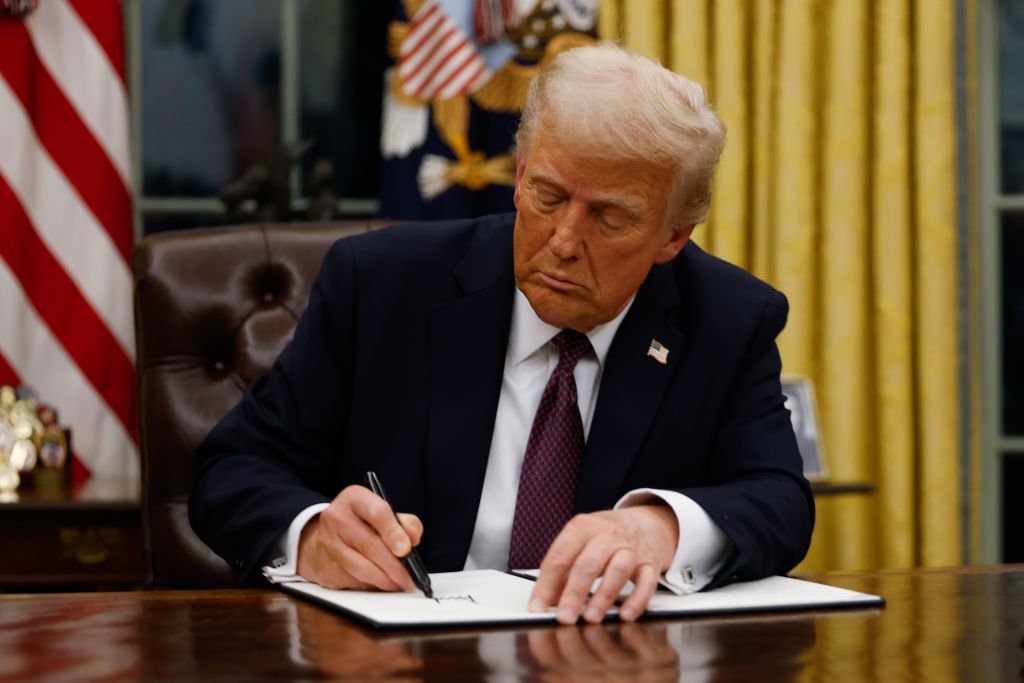 President Donald Trump signs executive orders in the Oval Office of the White House on Jan. 20, 2025, in Washington, D.C.  (Photo by Anna Moneymaker/Getty Images)