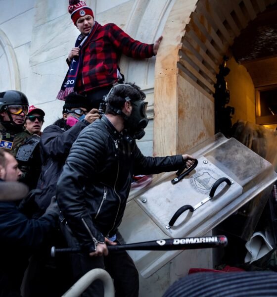 Donald Trump supporters clash with police and security forces as they storm the U.S. Capitol on Jan. 6, 2021 in Washington, D.C. (Photo by Brent Stirton/Getty Images)